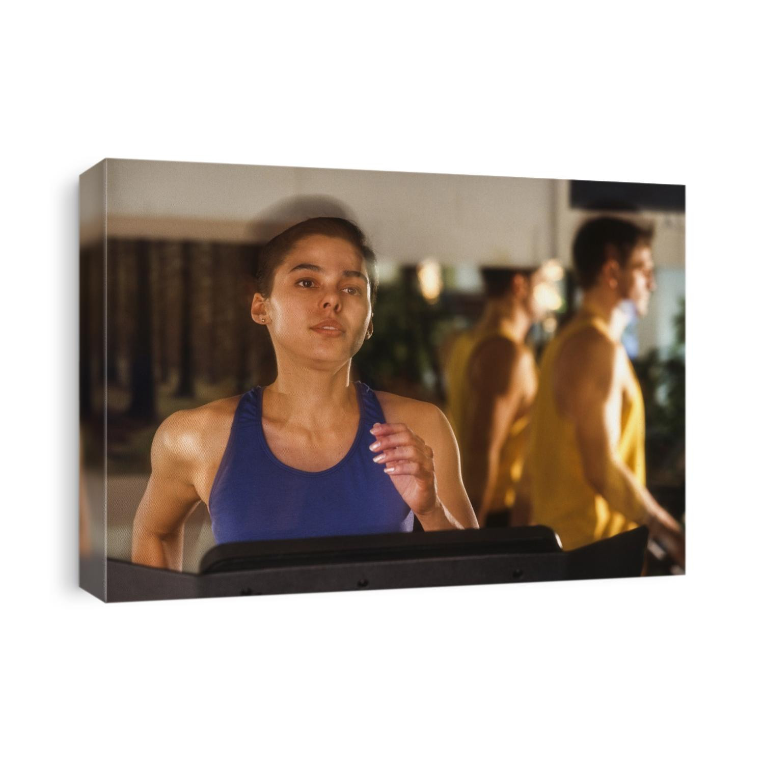 Woman exercising on a tredmill at a health club.