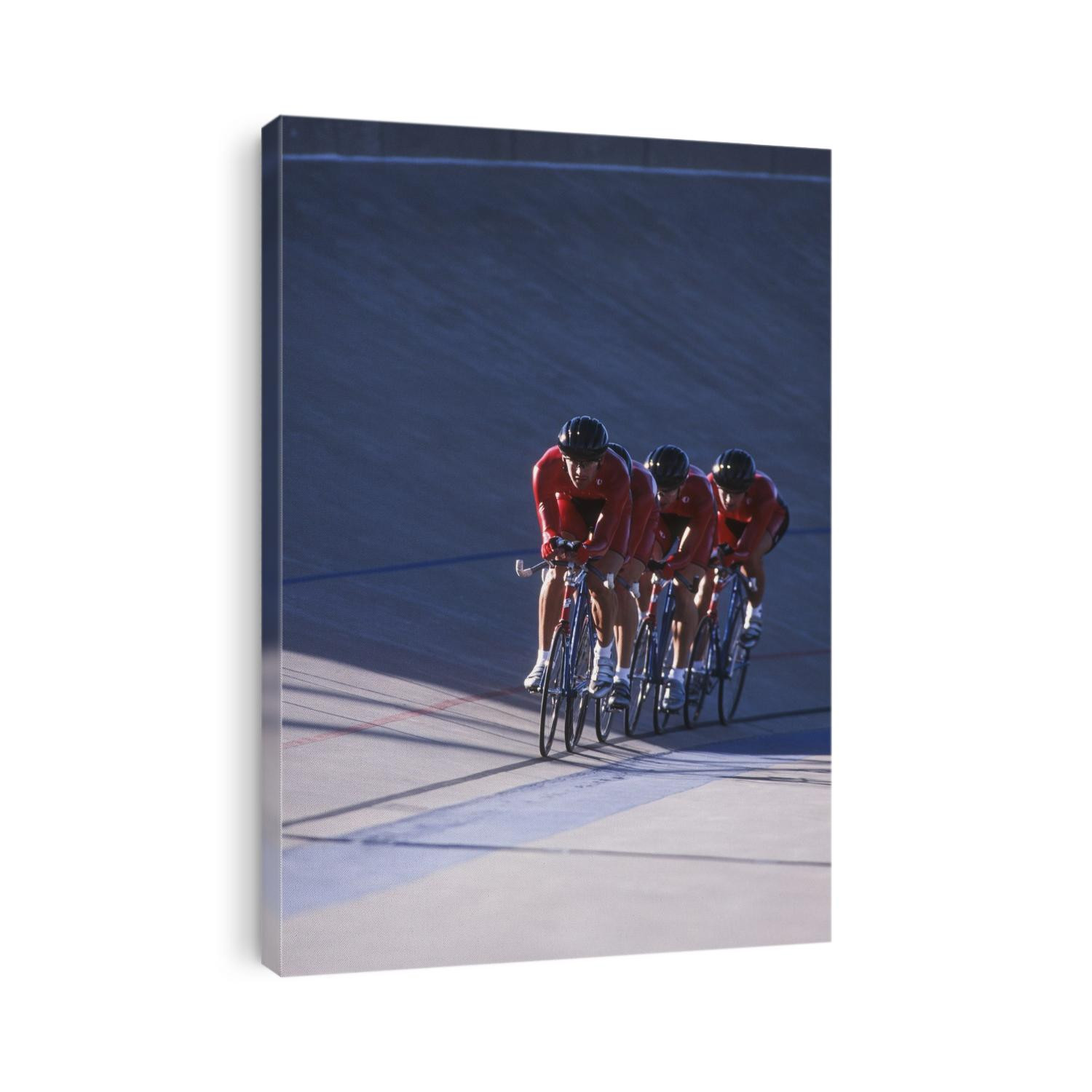 Male cycling team on the velodrome.