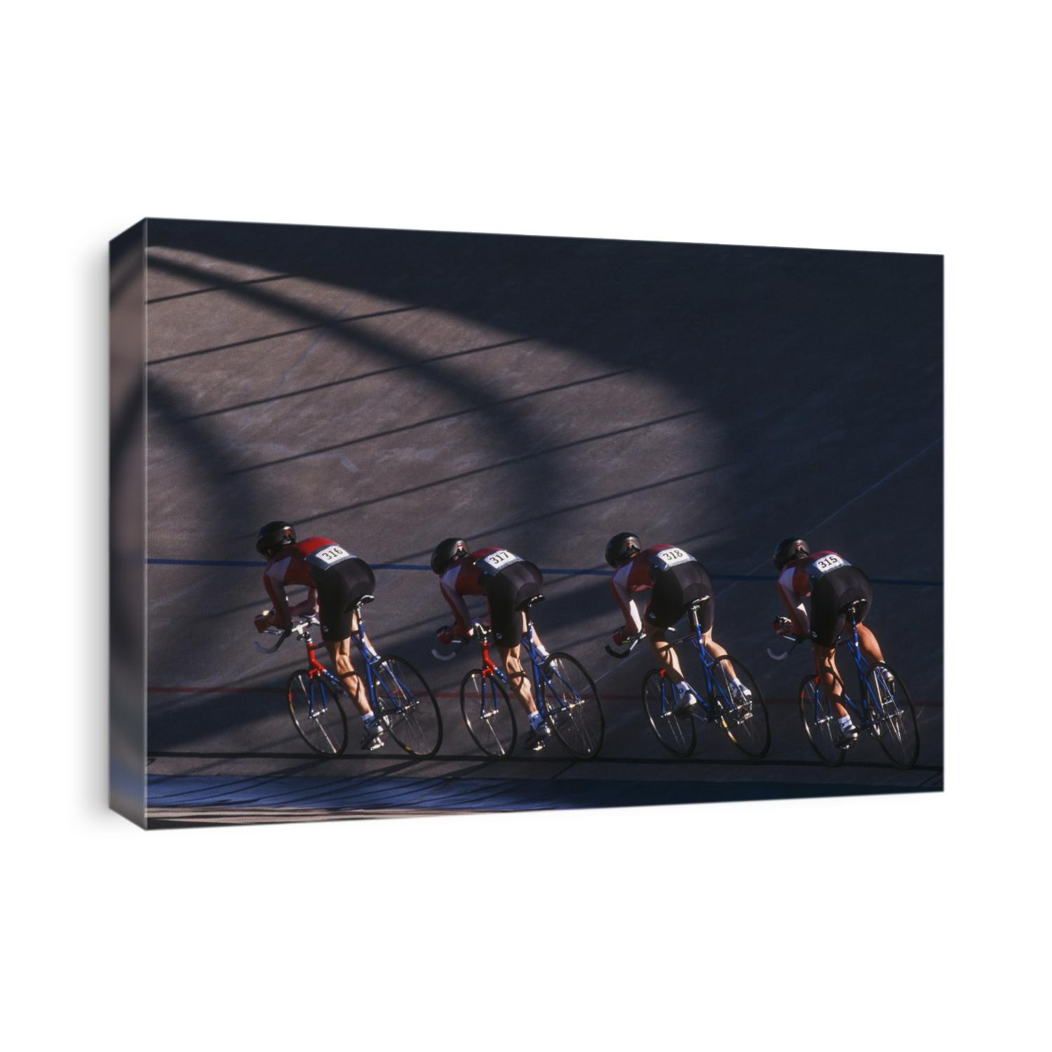 Male cycling team on the velodrome.