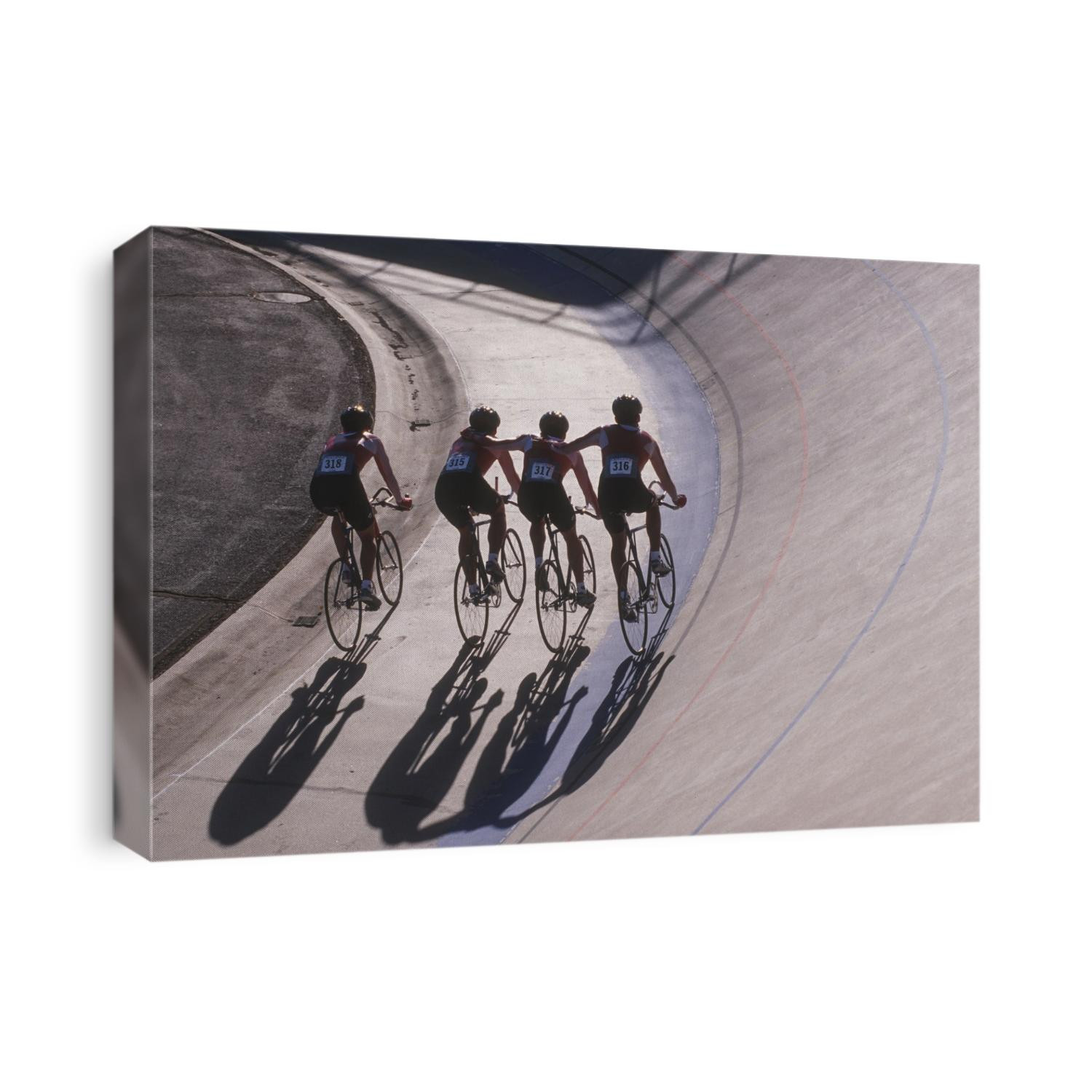 Male cycling team on the velodrome.