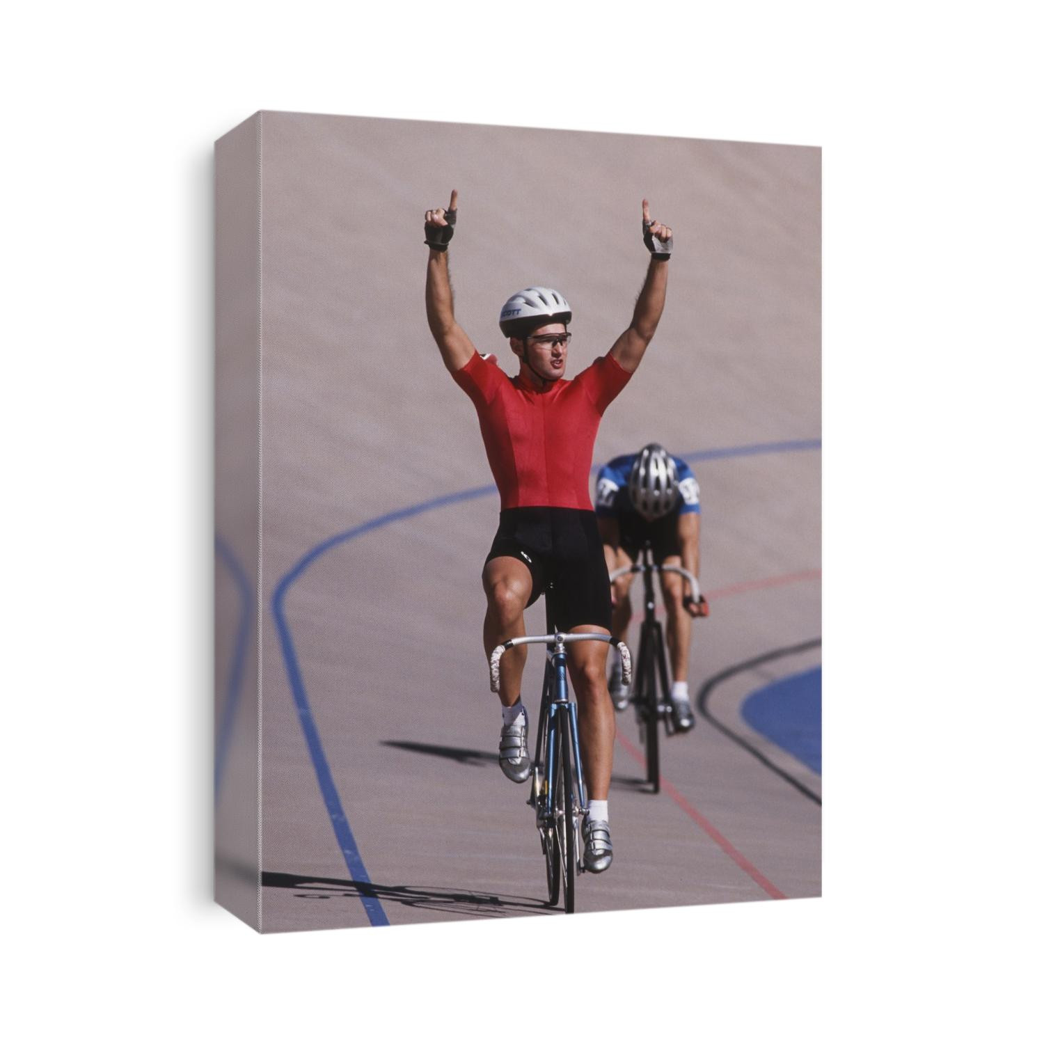 Male cyclist winning on the velodrome.