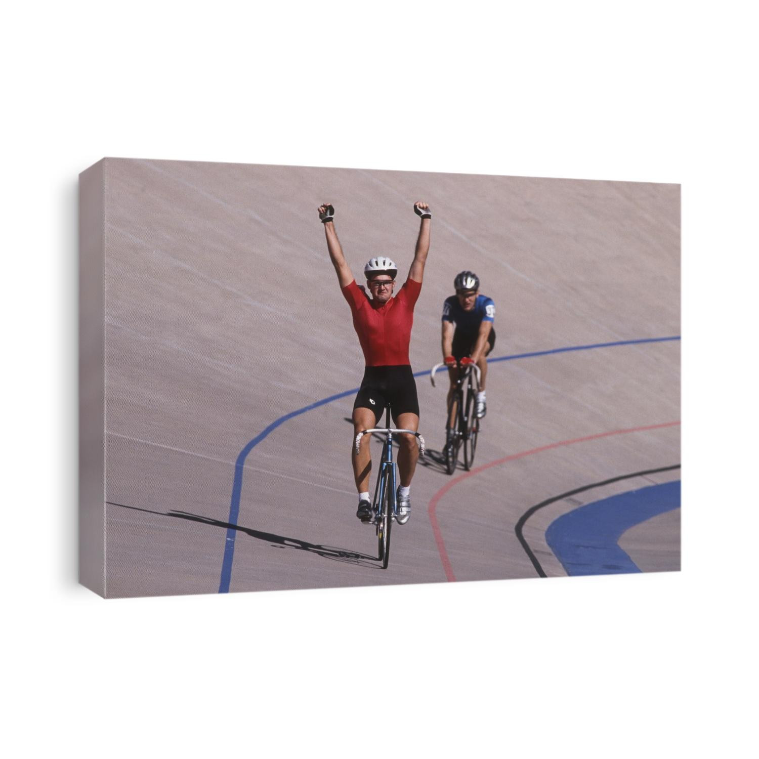 Male cyclist winning on the velodrome.