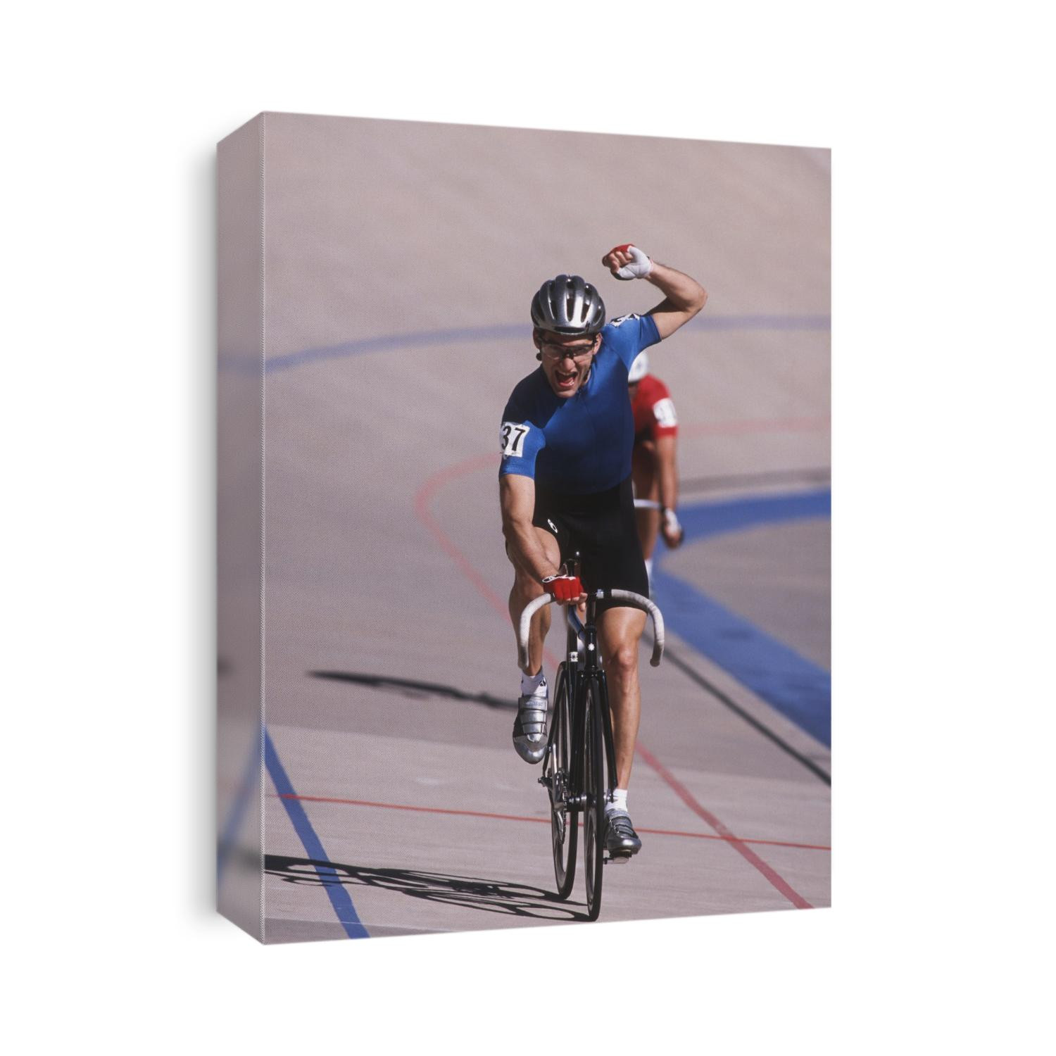 Male cyclist winning on the velodrome.
