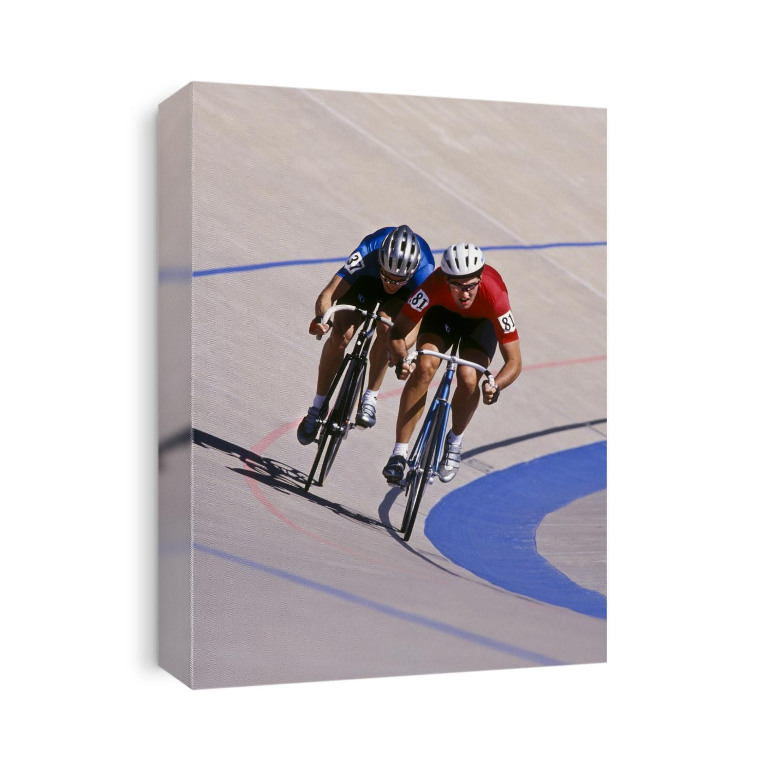 Male cyclists racing on the velodrome track.