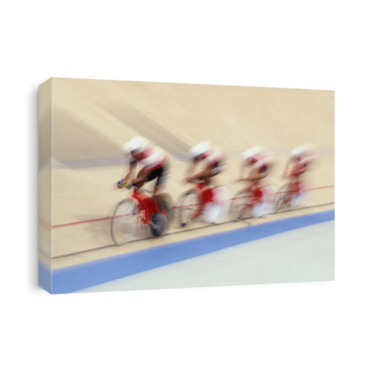 Cycling team competing on the velodrome.