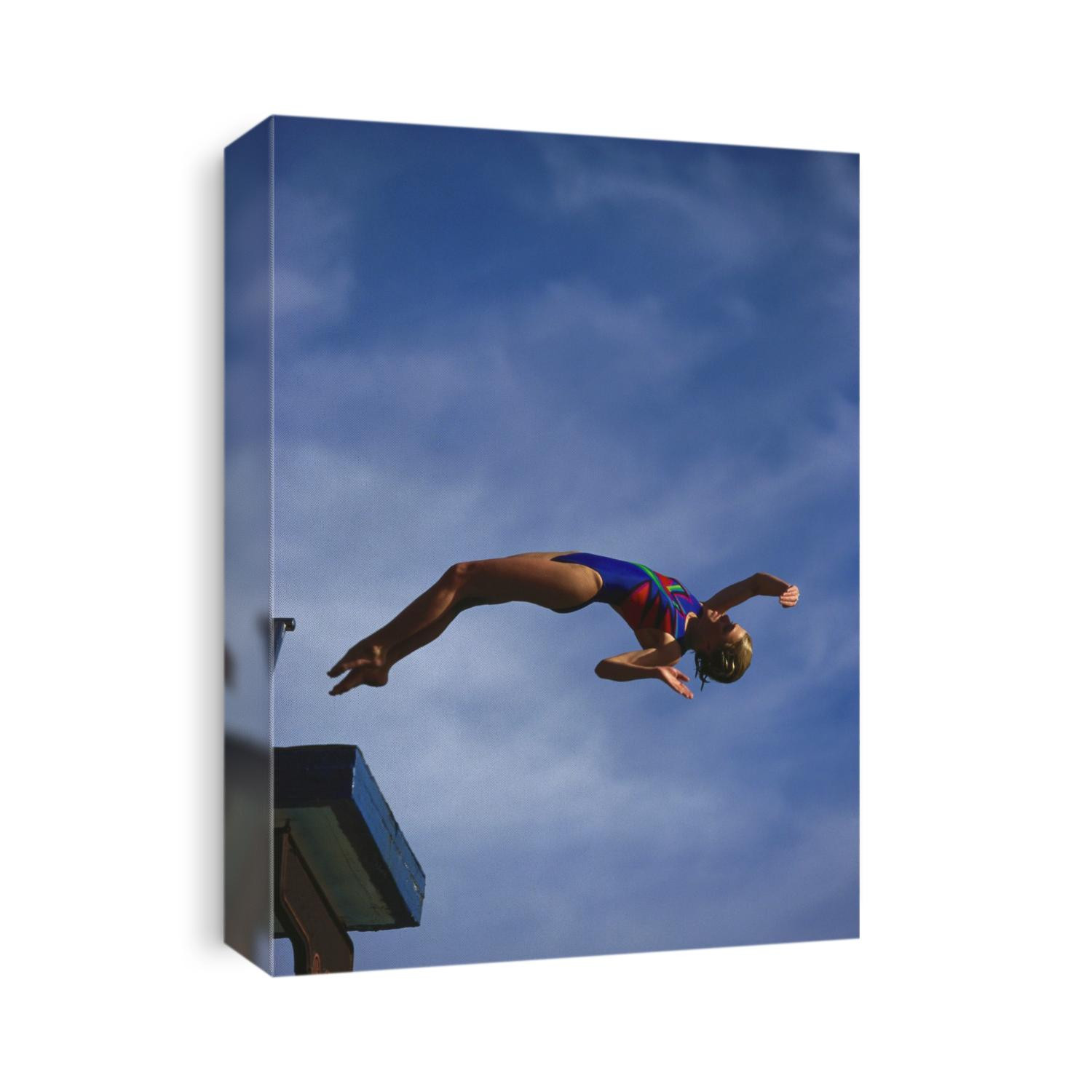 Young girl diving off the 10m platform.
