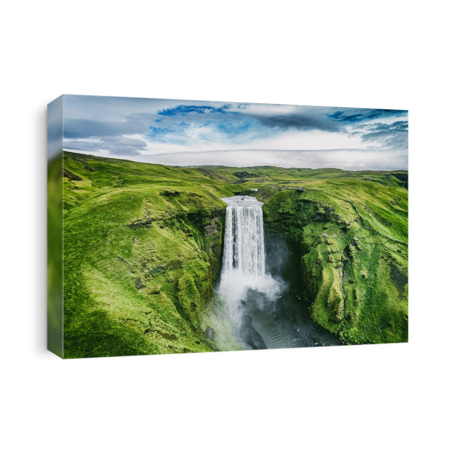 Iceland waterfall Skogafoss in Icelandic nature landscape. Famous tourist attractions and landmarks destination in Icelandic nature landscape on South Iceland. Aerial drone view of top waterfall.