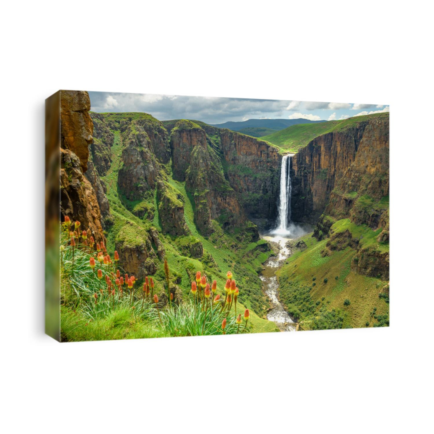 Maletsunyane Falls in Lesotho Africa. Most beautiful waterfall in the world. Green scenic landscape of amazing water fall dropping into a river inside canyons. Panoramic views over the great falls.
