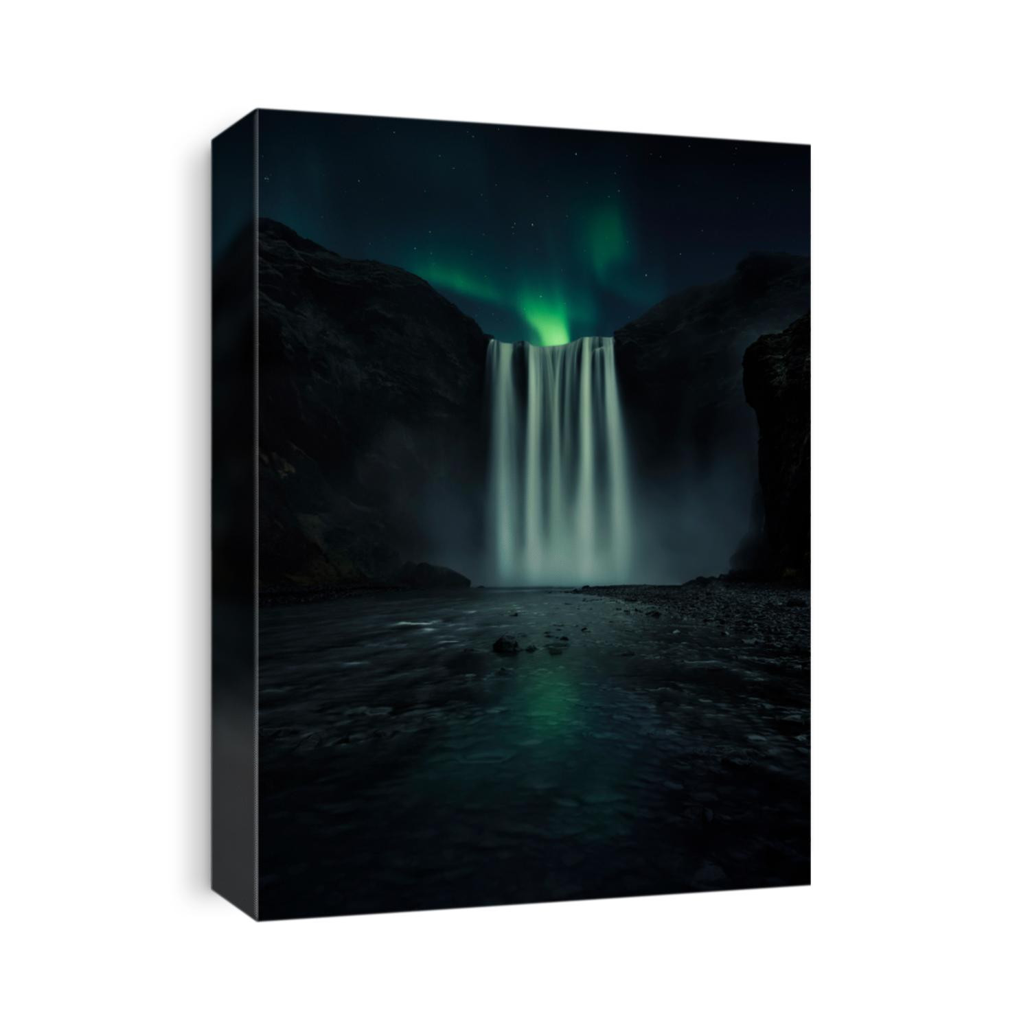 Magical northern lights appearing behind the Icelandic waterfall, in Skogafoss