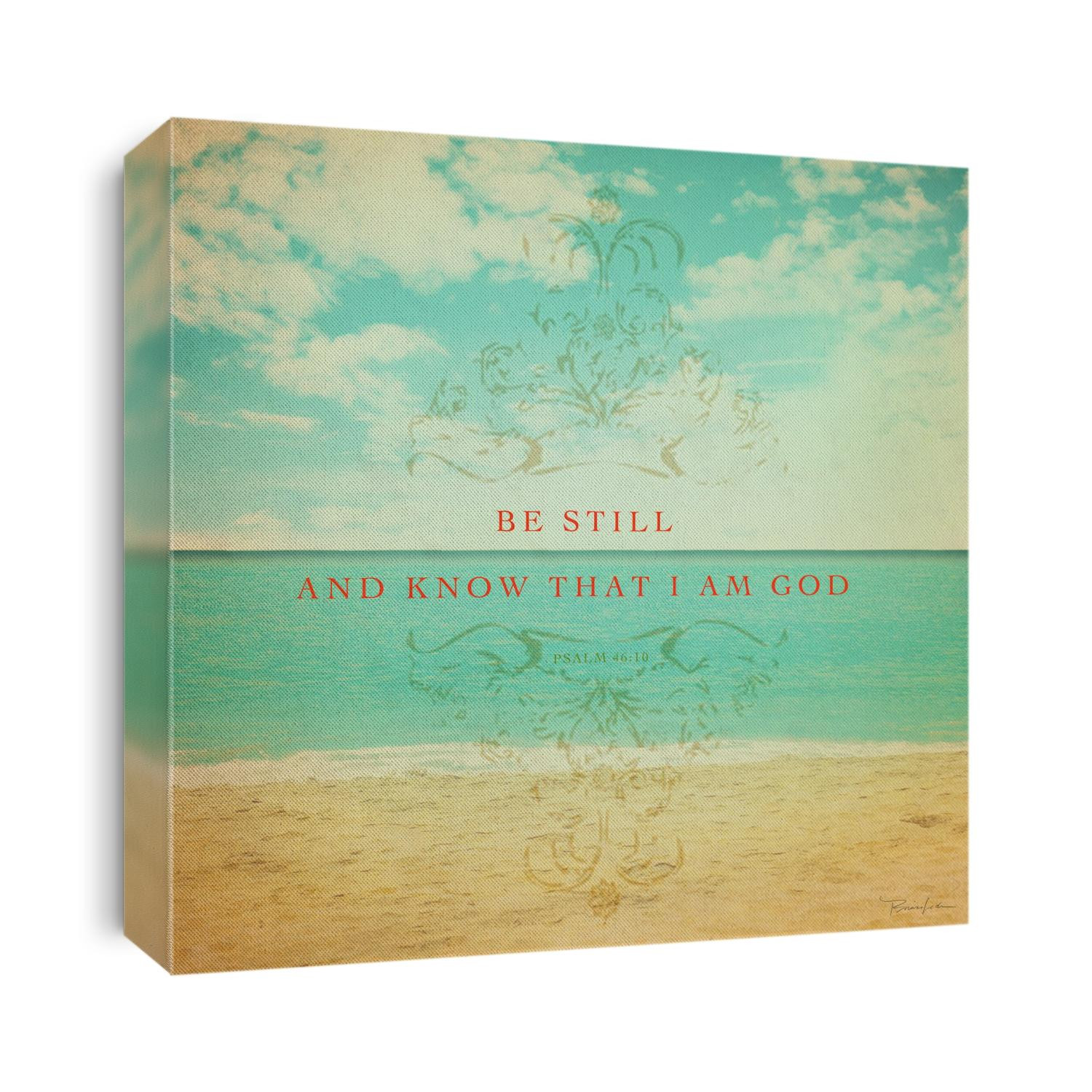 Calm sandy beach under blue sky with clouds and Psalm 46:10