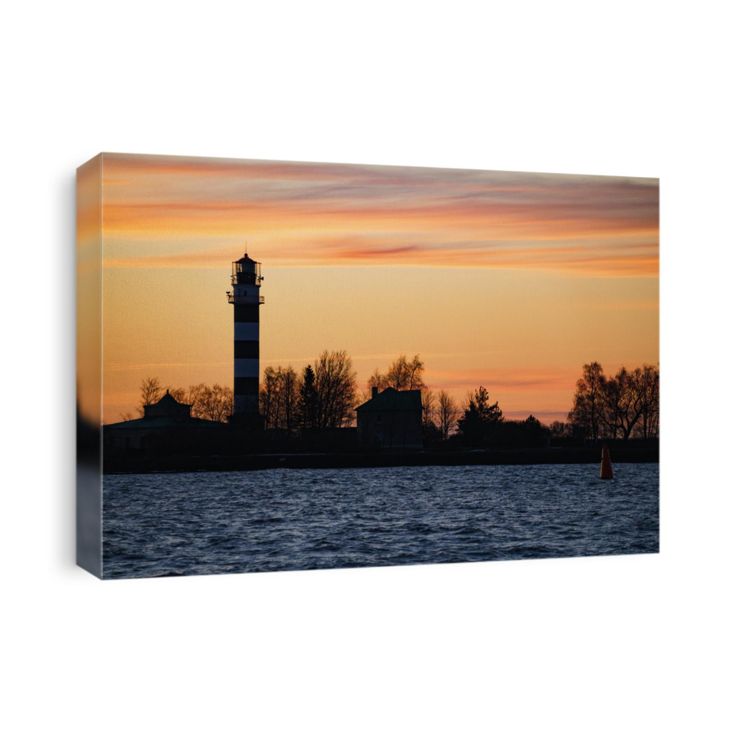 Seascape at sunset. Lighthouse on the coast.