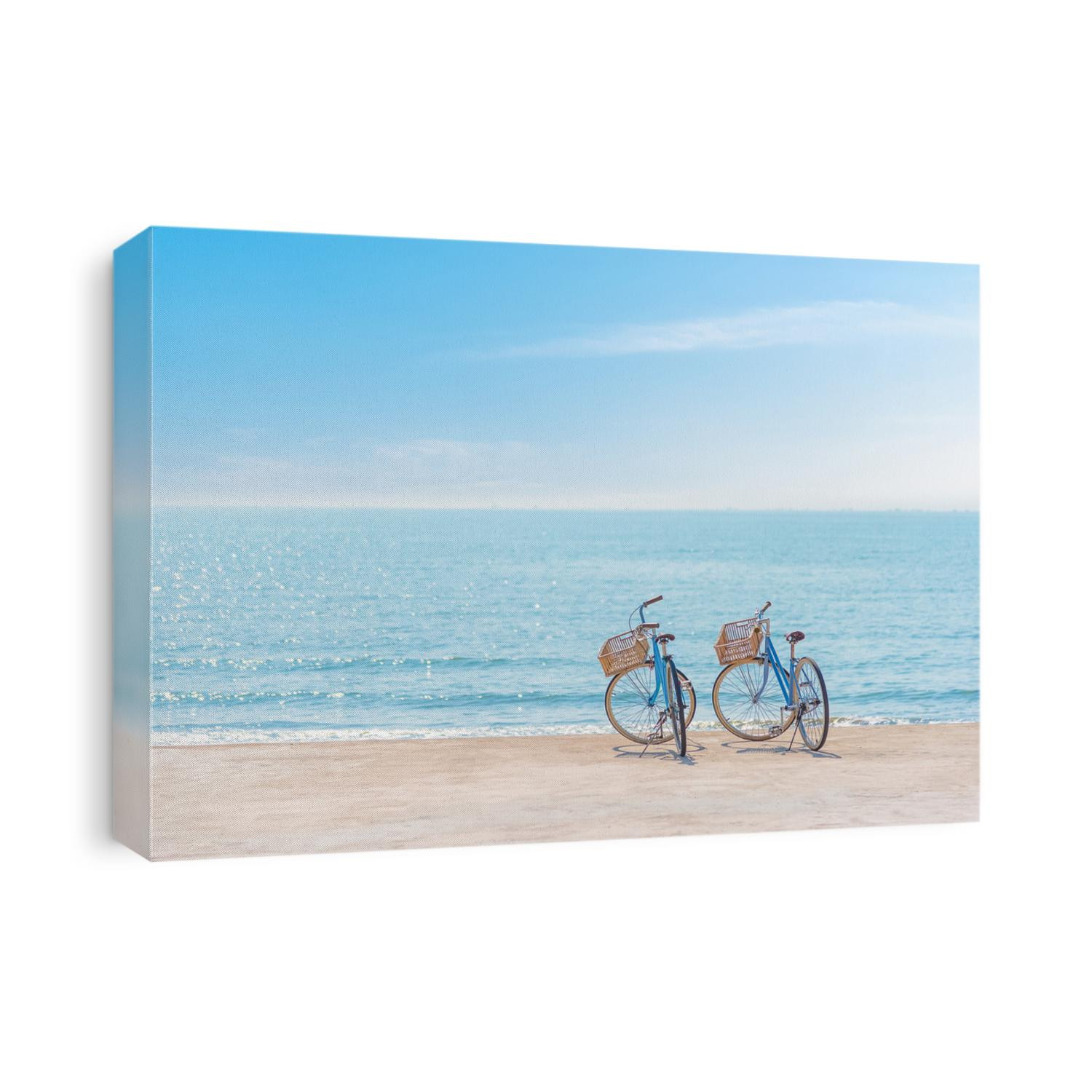Two bicycle at the beach on blue sky
