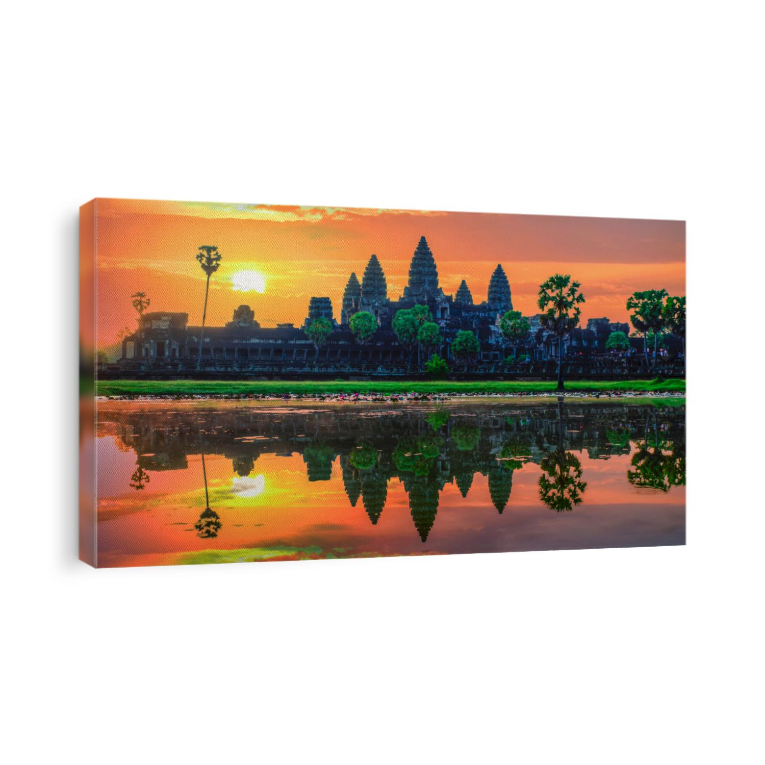 “Sunrise view of popular tourist attraction ancient temple complex Angkor Wat with reflected in lake Siem Reap, Cambodia.