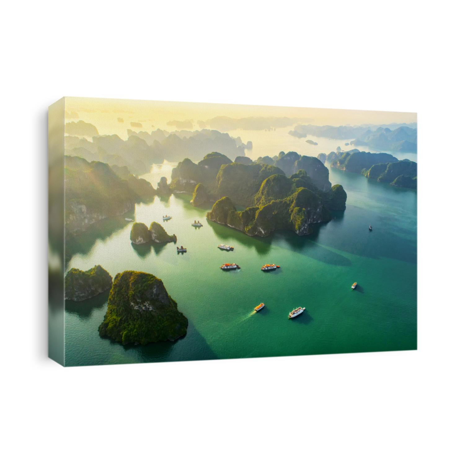 Aerial view floating fishing village and rock island, Halong Bay, Vietnam, Southeast Asia. UNESCO World Heritage Site. Junk boat cruise to Ha Long Bay. Popular landmark, famous destination of Vietnam
