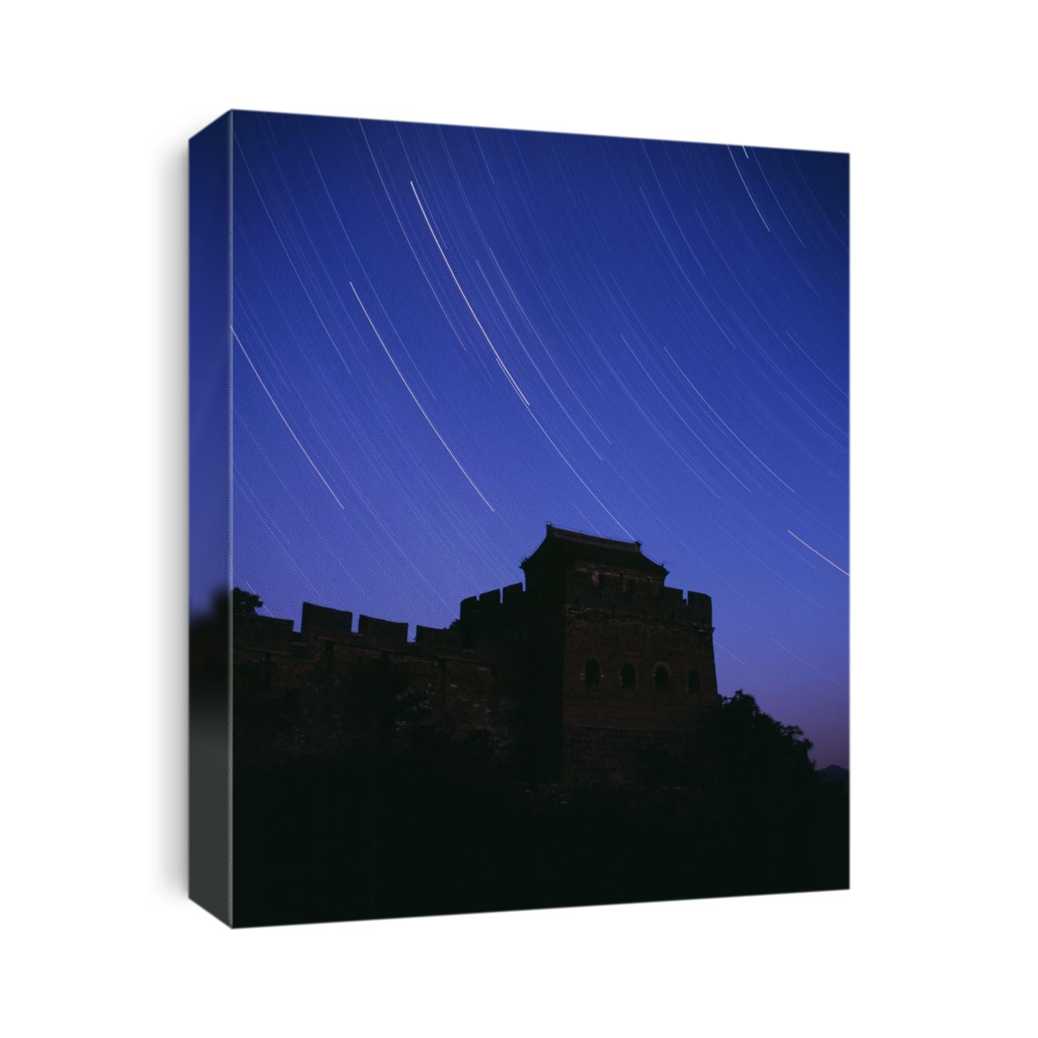 Stars track surrounding the Great Wall in a starry night.