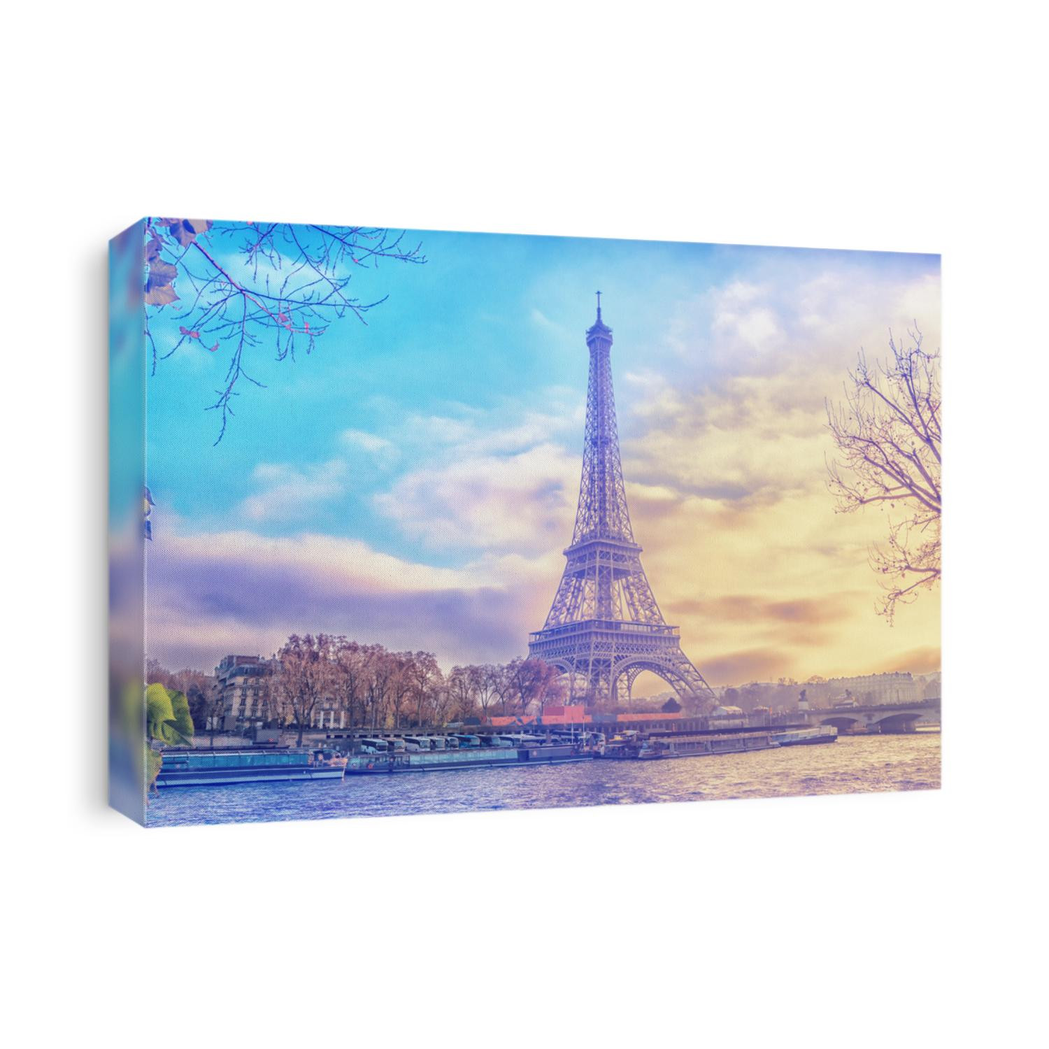 Eiffel Tower at sunset in Paris, France. Romantic travel background.