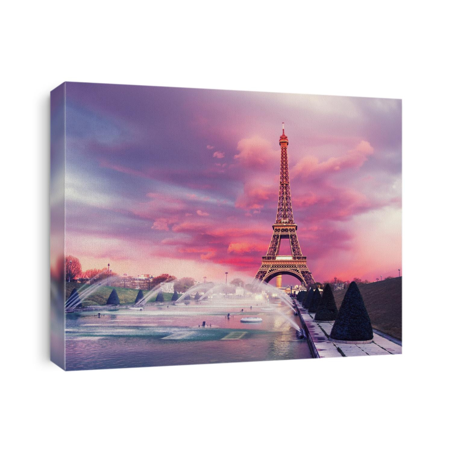 Eiffel tower on a sunset half-lit with last rays of the setting sun. Illumination is still switched off. Panoramic toned image.