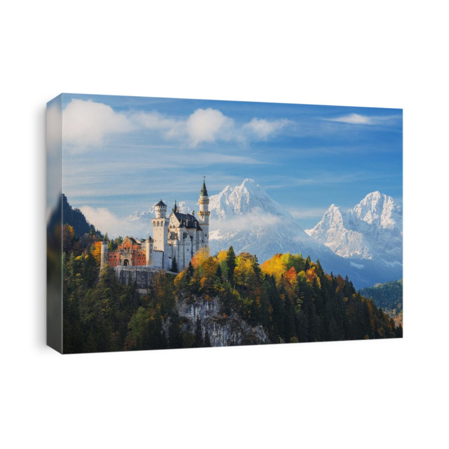 Germany. The famous Neuschwanstein Castle in the background of snowy mountains and trees with yellow and green leaves.