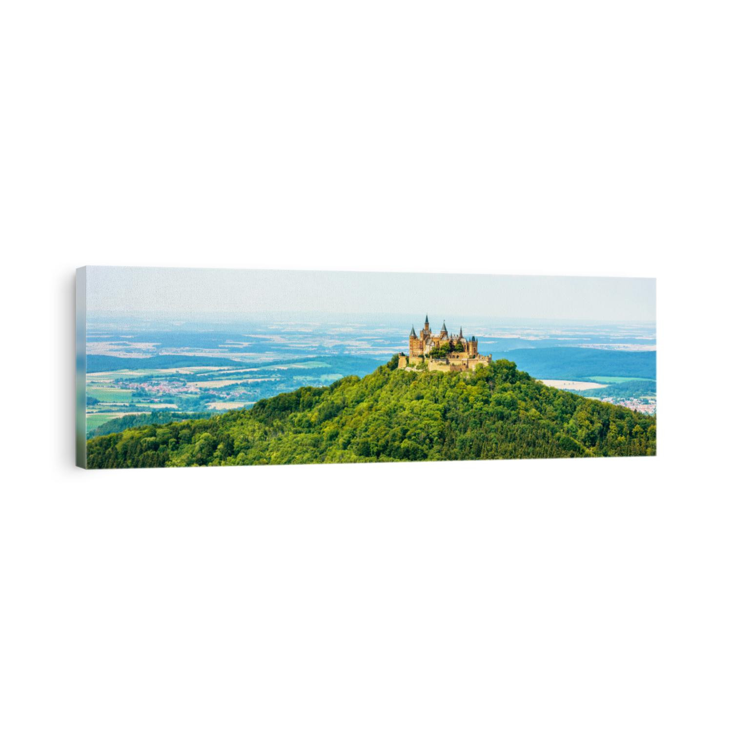 Hohenzollern Castle on mountain top, panoramic view in summer, Germany. Old German burg like medieval castle is landmark in Stuttgart vicinity. Landscape of Swabian Alps, skyline with Gothic castle.