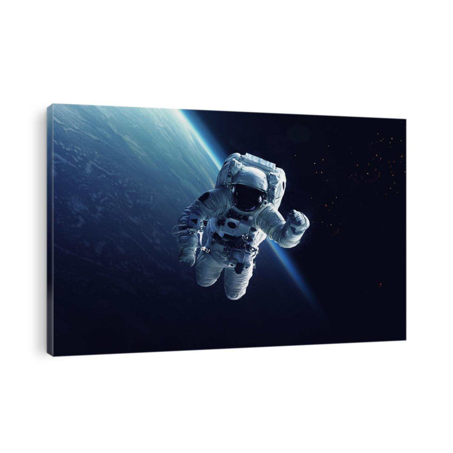 Astronaut at spacewalk. Cosmic art, science fiction wallpaper. Beauty of deep space. Billions of galaxies in the universe. Elements of this image furnished by NASA