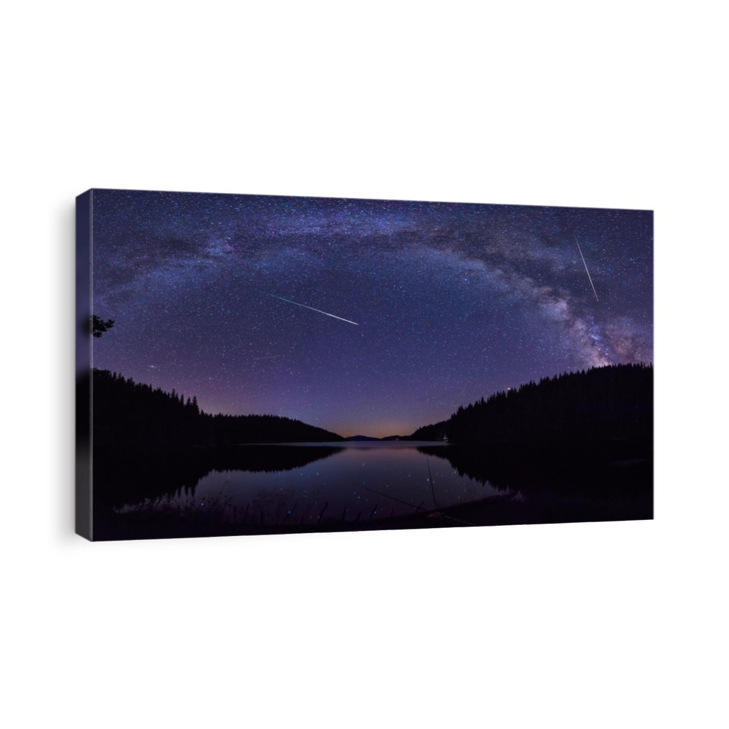 Long time exposure night landscape with Milky Way Galaxy during the Perseids flow above the Beglik dam in Rhodopi Mountains, Bulgaria