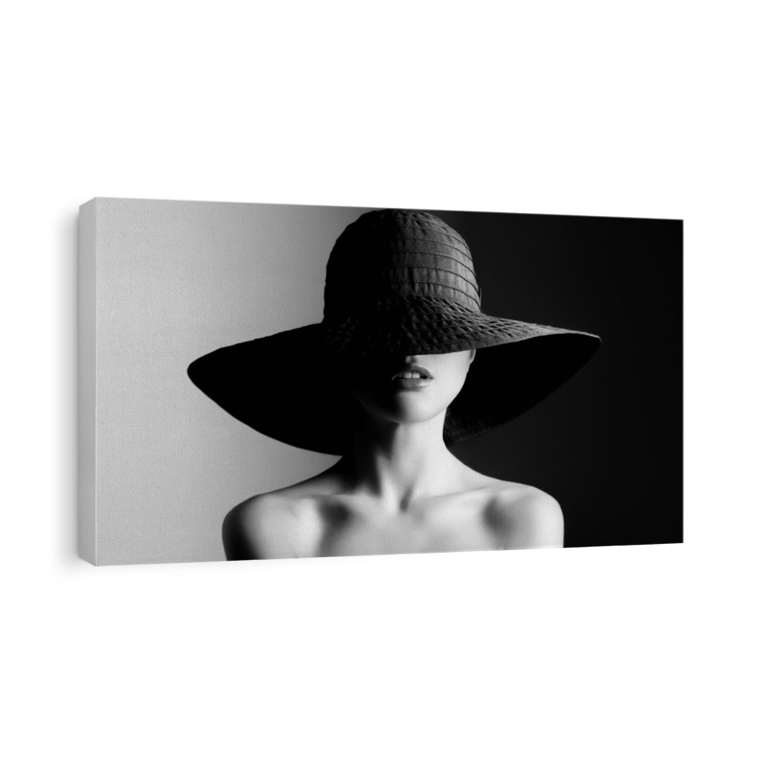 Fashion woman in hat. Contrast black and white.