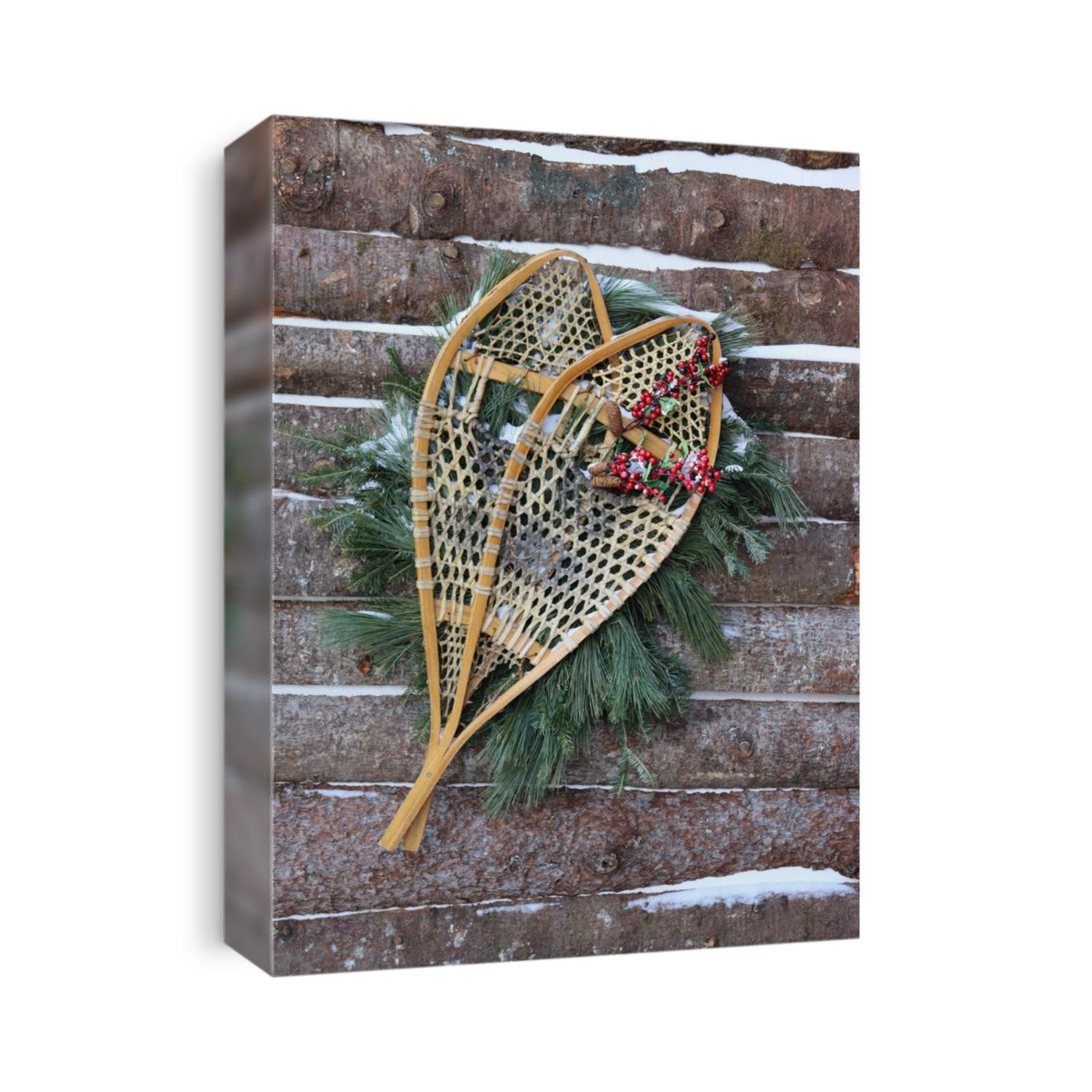 a pair of old wooden racket attached to a wooden wall in old quebec canada