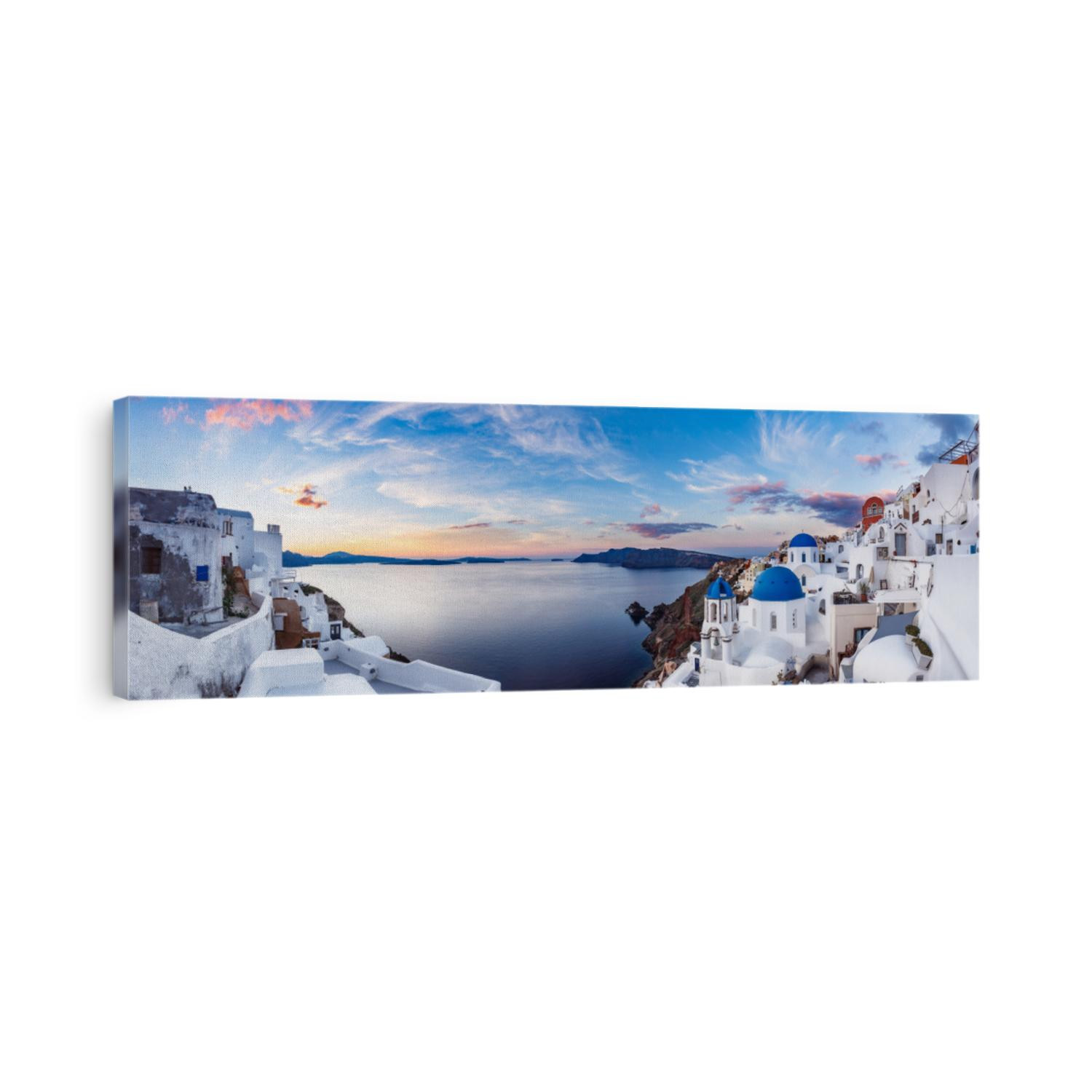 Beautiful panorama view of Oia village on Santorini island in Greece at sunrise with dramatic sky. 