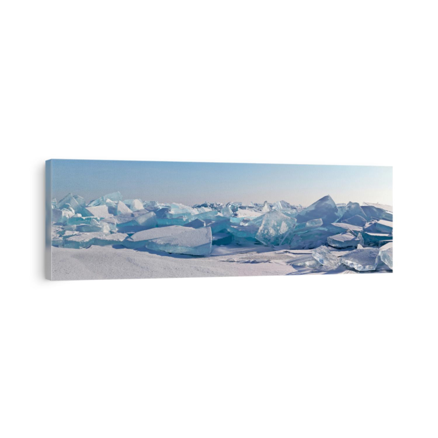 A panorama of the edge of a hummock field with beautiful huge blocks of transparent blue ice on the frozen Lake Baikal on a sunny frosty day. Cool natural background. Unusual winter landscape