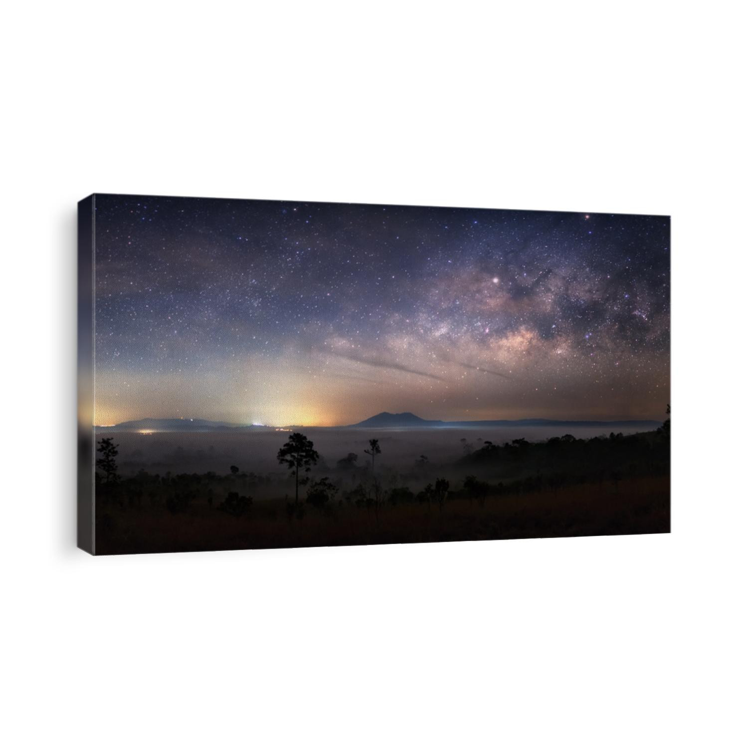 Milky way on mountain with mist field. Night sky
