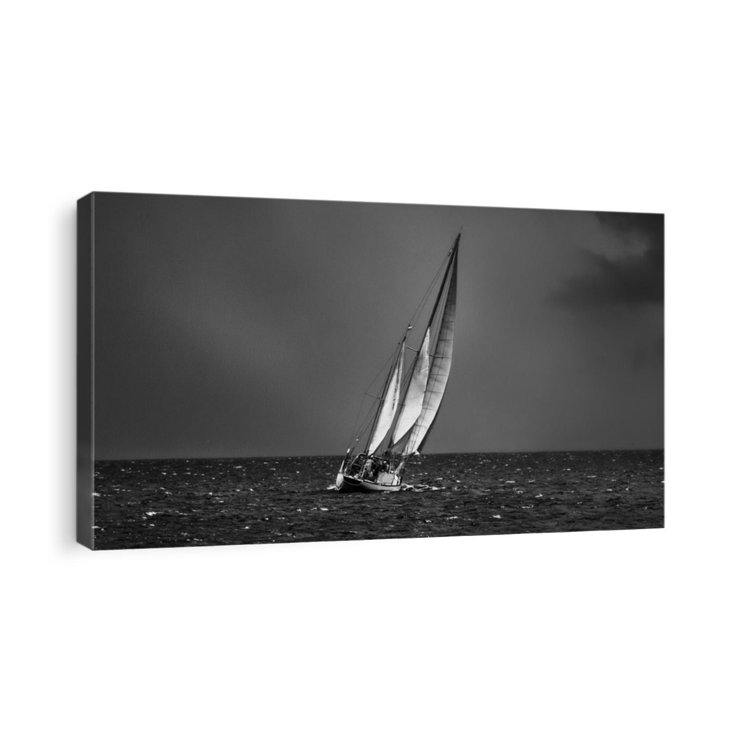 Old expensive vintage two-masted sailboat (yawl) close-up, sailing in an open sea during the storm. Dramatic sky, dark clouds. Sport, regatta, recreation, transportation. Panoramic view, seascape