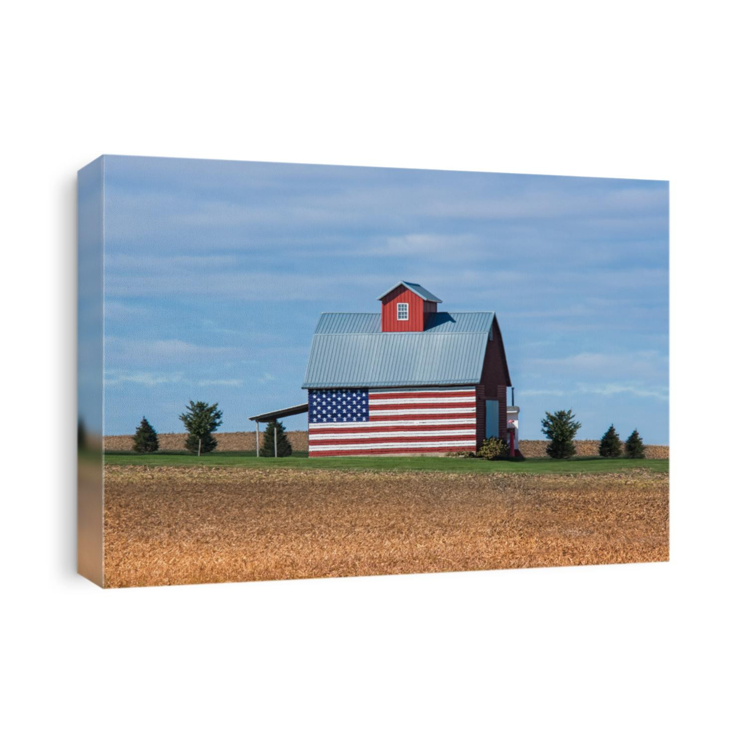 Awesome old barn with an American flag on the side.